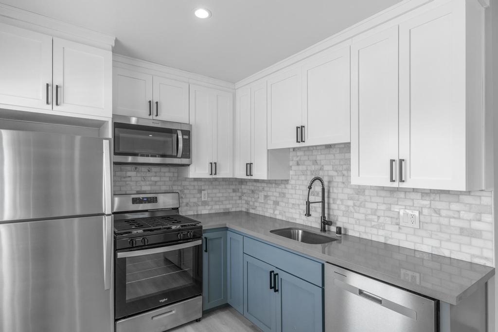 128 Bristol Boulevard San Leandro, CA 94577 - Photo 10 of 32 a kitchen with stainless steel appliances granite countertop a sink stove and refrigerator