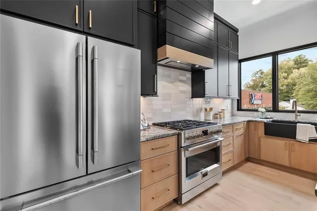 a kitchen with a stove a refrigerator and a stove
