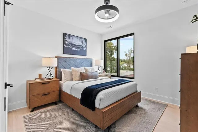 a bed room with a bed and a window