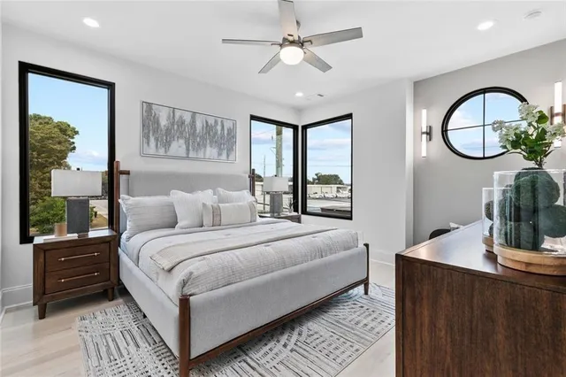 a bedroom with a large bed and a window