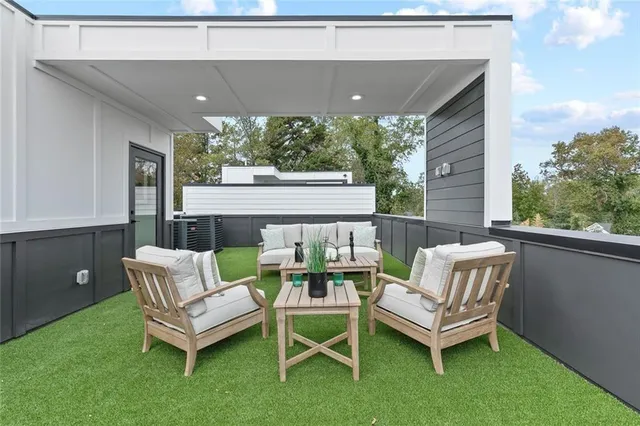 a view of a patio with a table and chairs