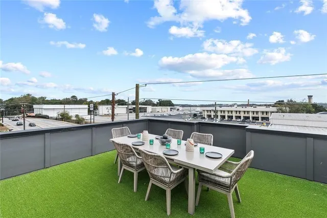 a view of a terrace with furniture and stove