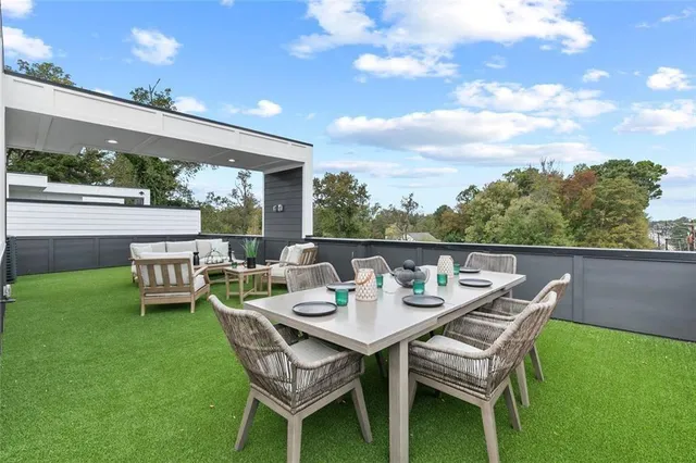 a view of an outdoor sitting area with furniture