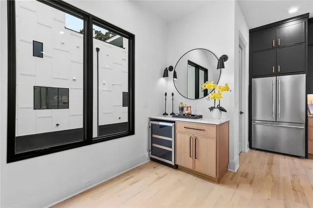 a kitchen with stainless steel appliances a refrigerator and a stove