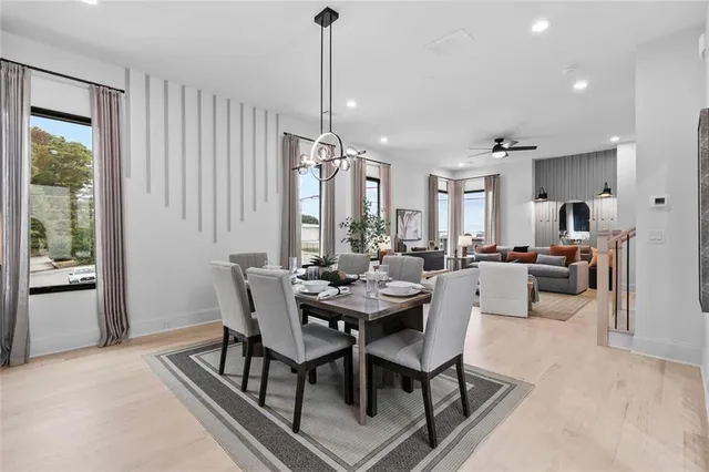 a view of a dining room with furniture window and wooden floor