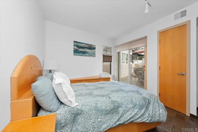 a bedroom with a bed and dresser