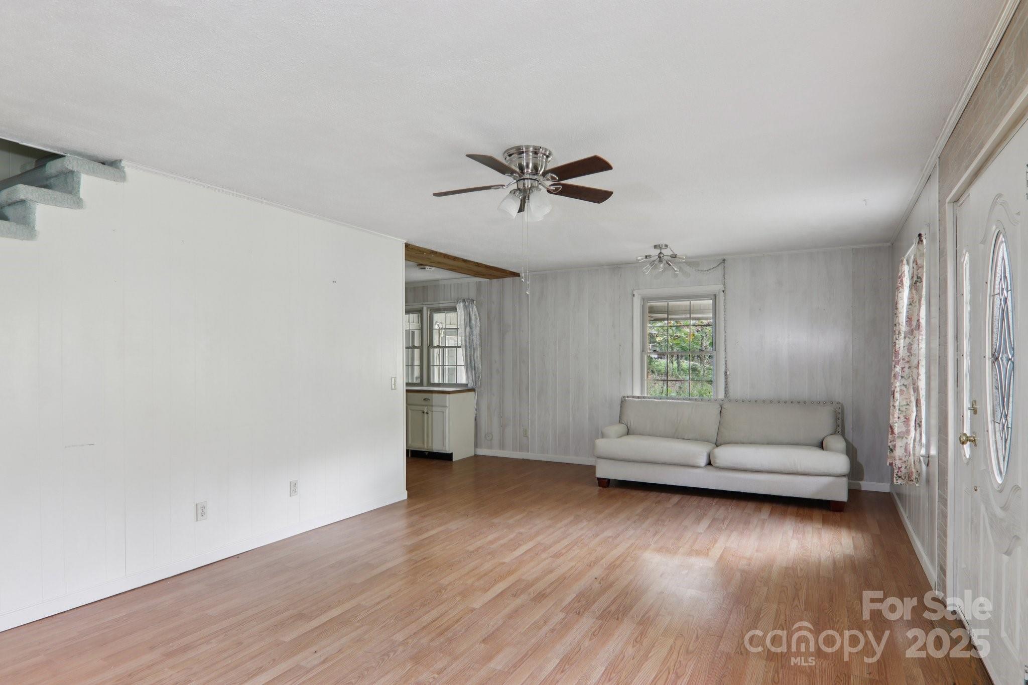 190 Turkey Creek Road Clyde, NC 28721 - Photo 18 of 48 wooden floor in an empty room with a window