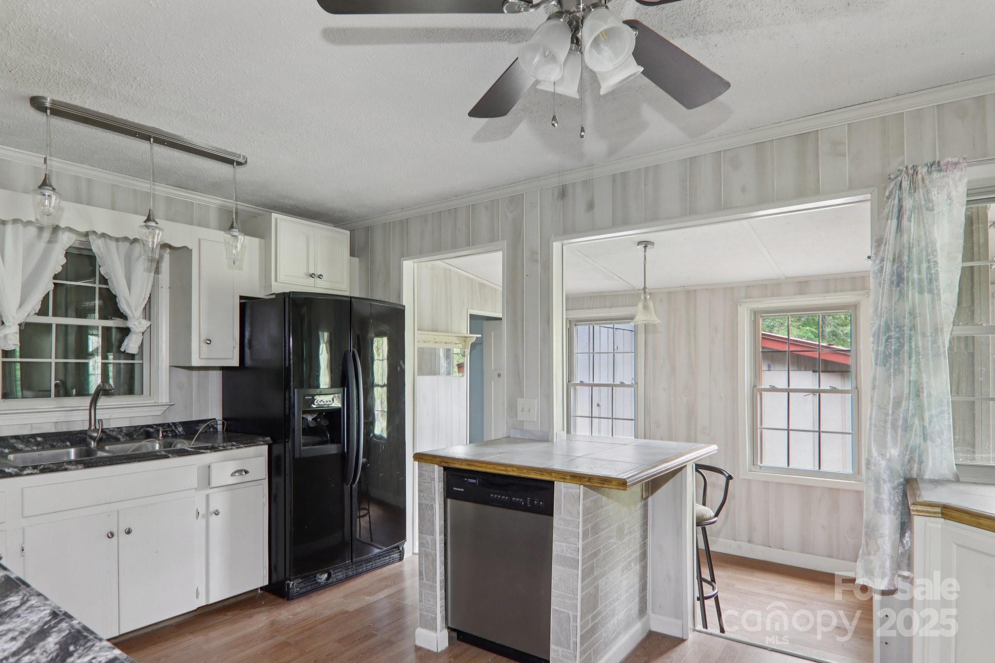 190 Turkey Creek Road Clyde, NC 28721 - Photo 26 of 48 a kitchen with stainless steel appliances a refrigerator and a stove top oven