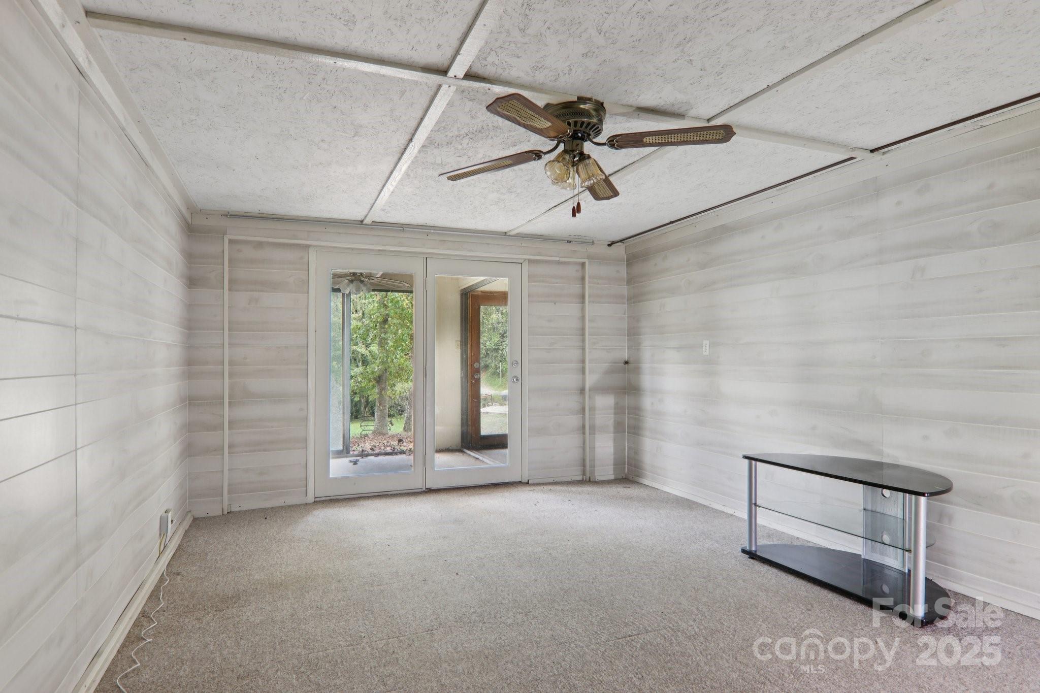 190 Turkey Creek Road Clyde, NC 28721 - Photo 29 of 48 a view of a livingroom with a ceiling fan and window