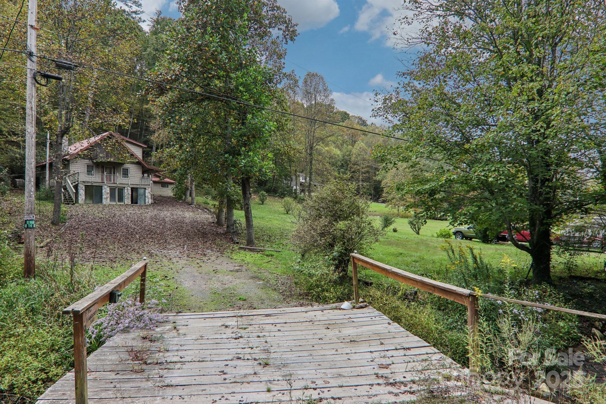 190 Turkey Creek Road Clyde, NC 28721 - Photo 3 of 48 a view of a house with a yard