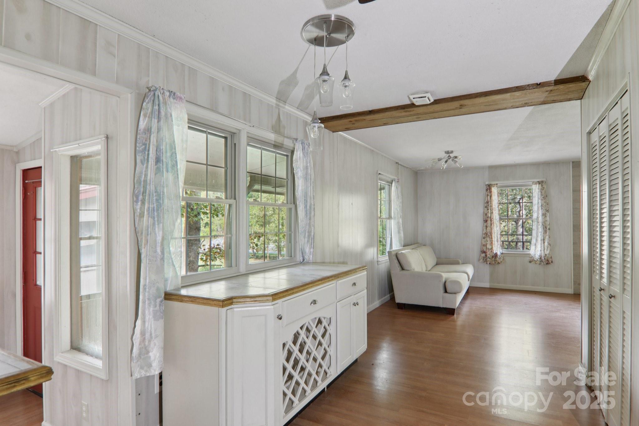 190 Turkey Creek Road Clyde, NC 28721 - Photo 34 of 48 a very nice looking room with a large window and wooden floor