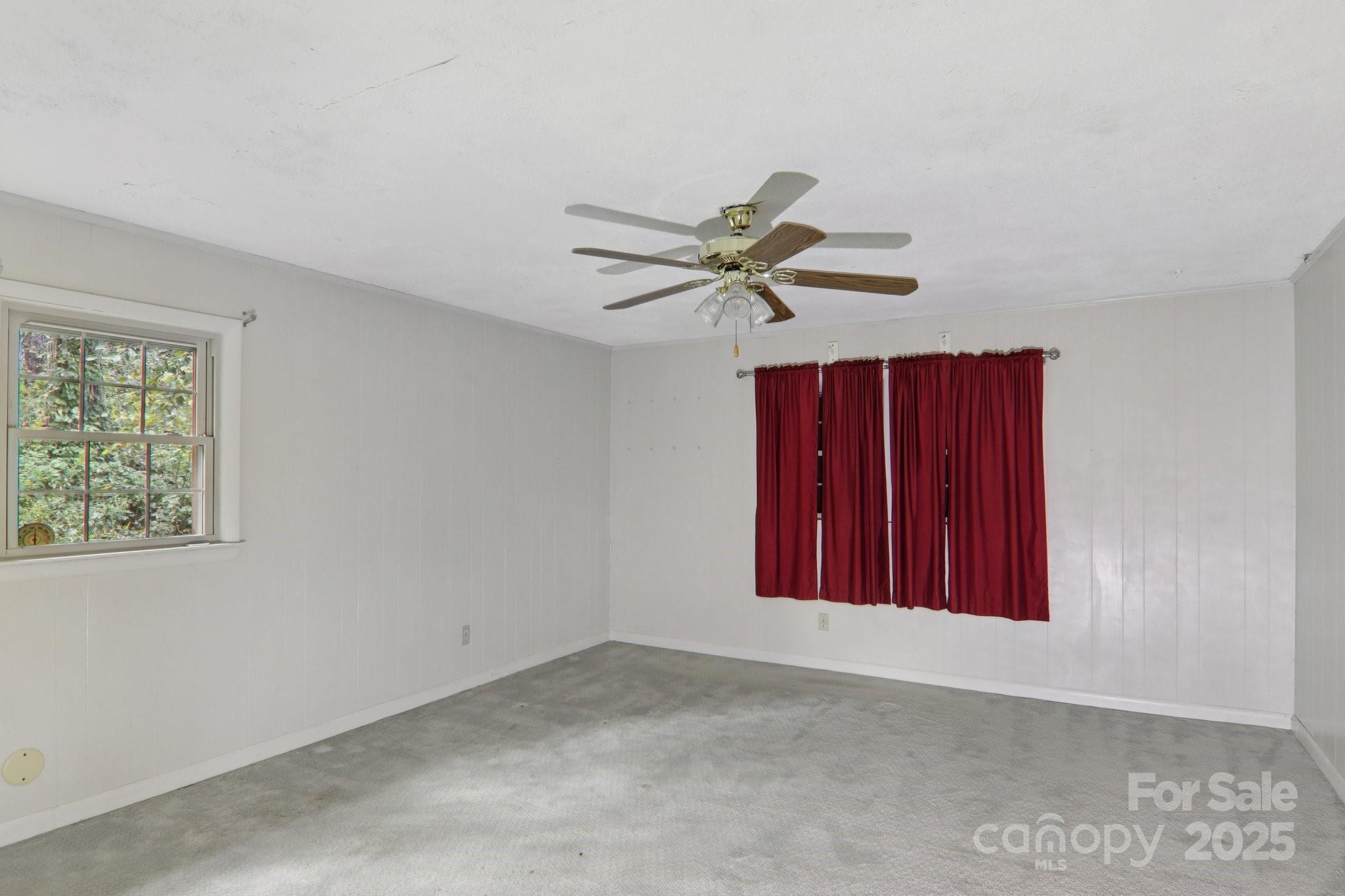 190 Turkey Creek Road Clyde, NC 28721 - Photo 38 of 48 an empty room with windows and fan