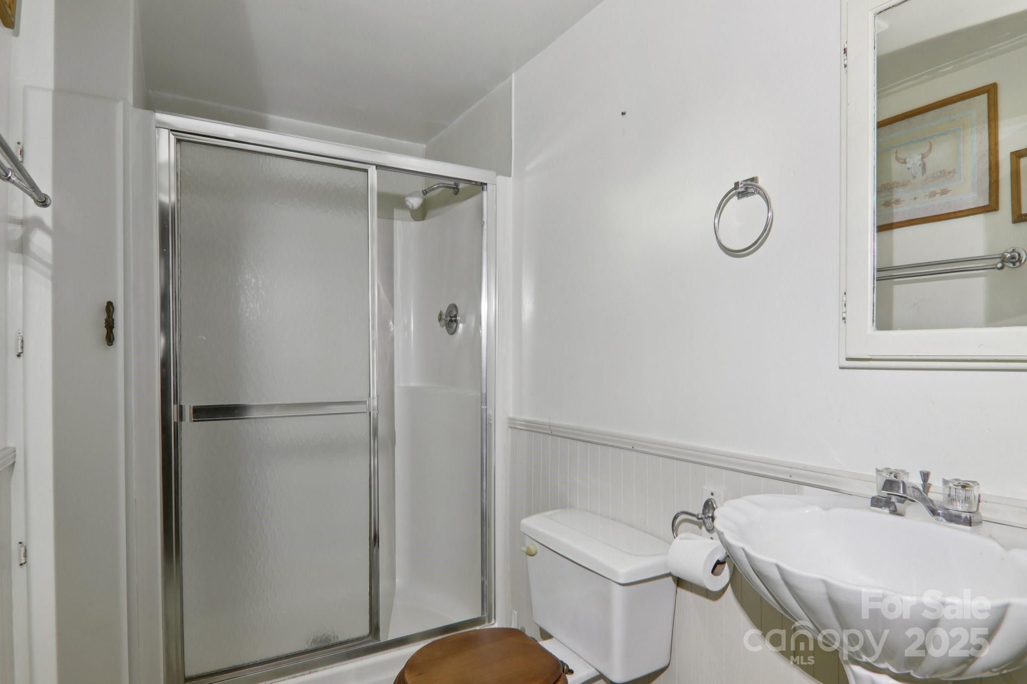 190 Turkey Creek Road Clyde, NC 28721 - Photo 40 of 48 a bathroom with a sink toilet and shower