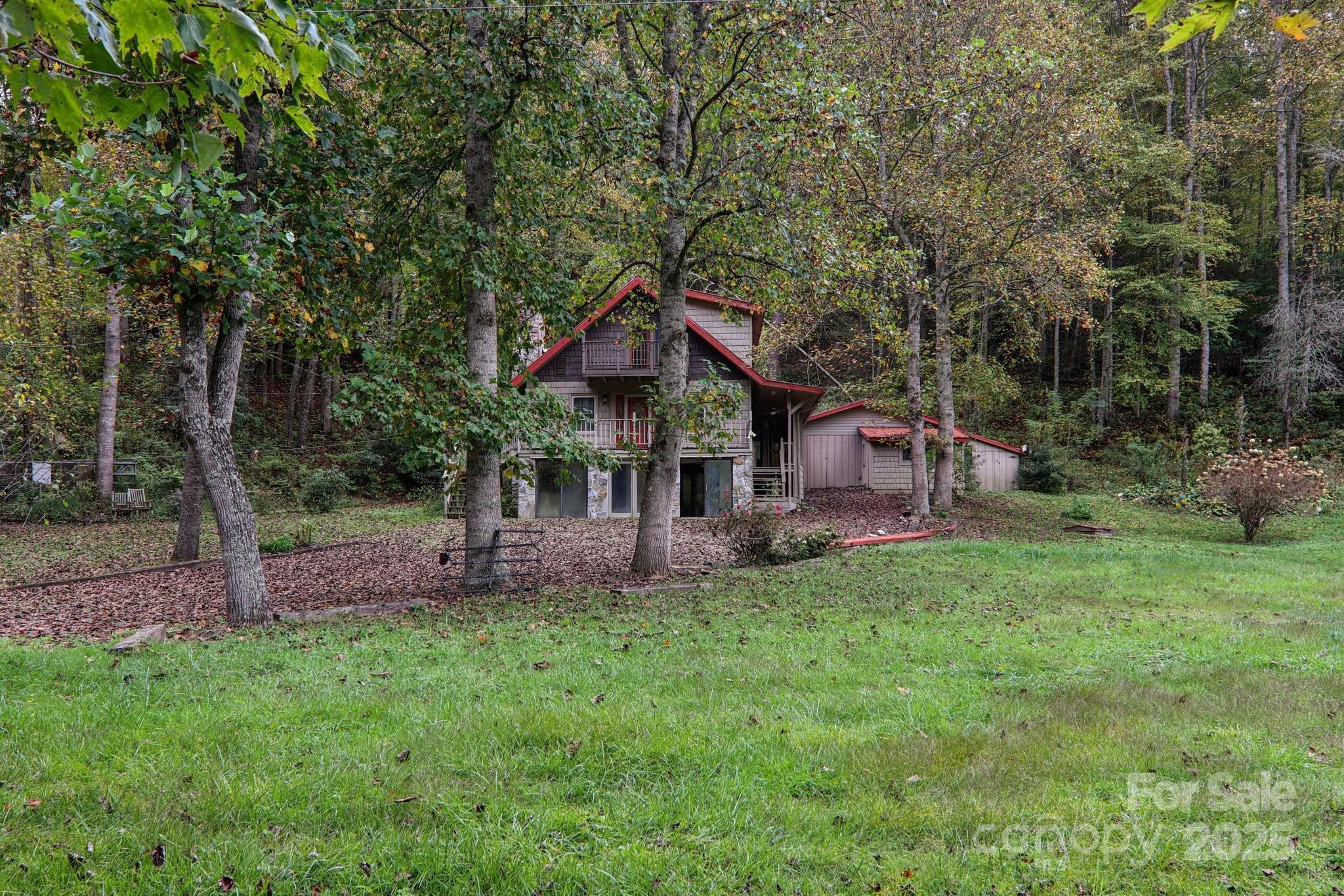 190 Turkey Creek Road Clyde, NC 28721 - Photo 10 of 48 a front view of a house with a yard