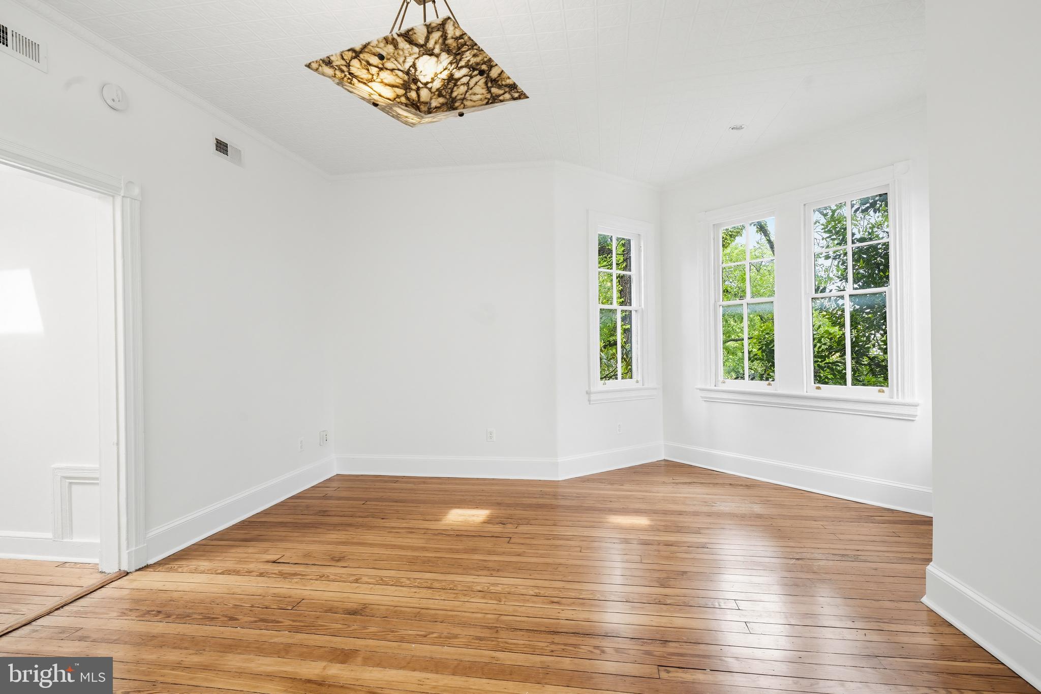 400 7th Street Southeast Washington, DC 20003 - Photo 13 of 23 a view of empty room with wooden floor and fan