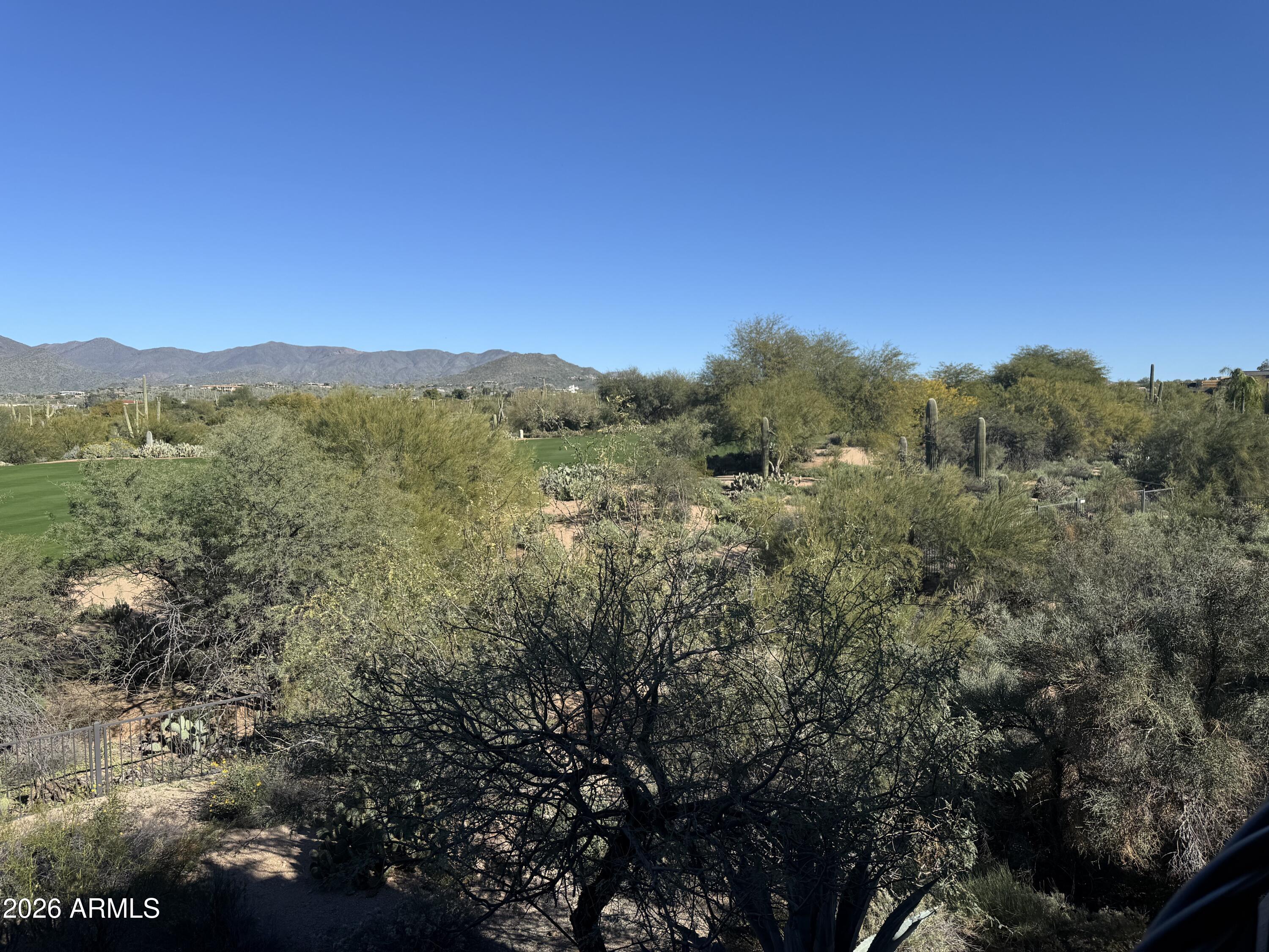 36601 North Mule Train Road, Unit D18 Carefree, AZ 85377 - Photo 15 of 57 a view of a mountain range with trees in the background