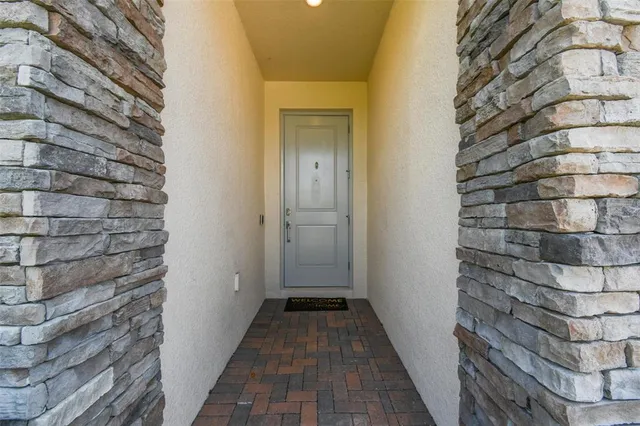 a kitchen with white cabinets and appliances
