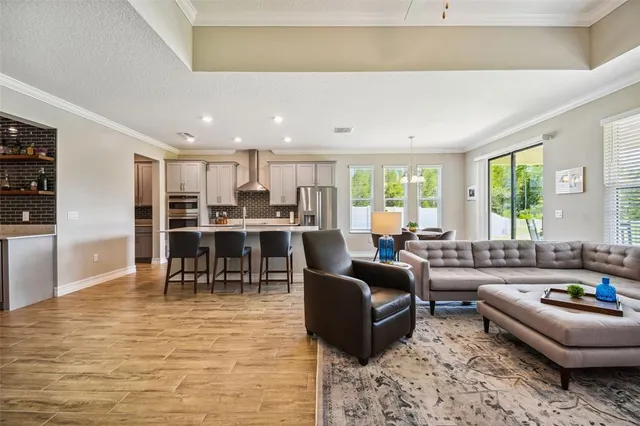 a kitchen with stainless steel appliances a refrigerator and a stove