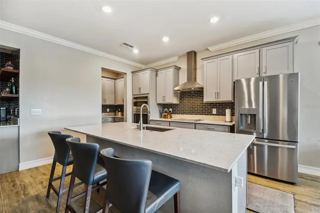a bed room with furniture and a flat screen tv