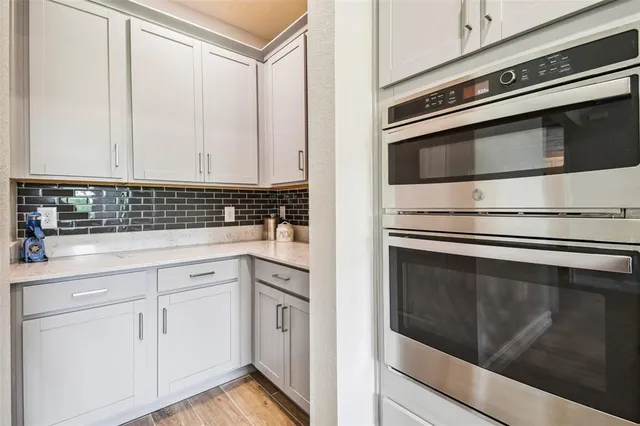 a view of a house with backyard porch and sitting area