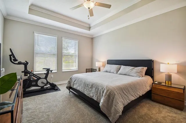 a view of a house with swimming pool and sitting area