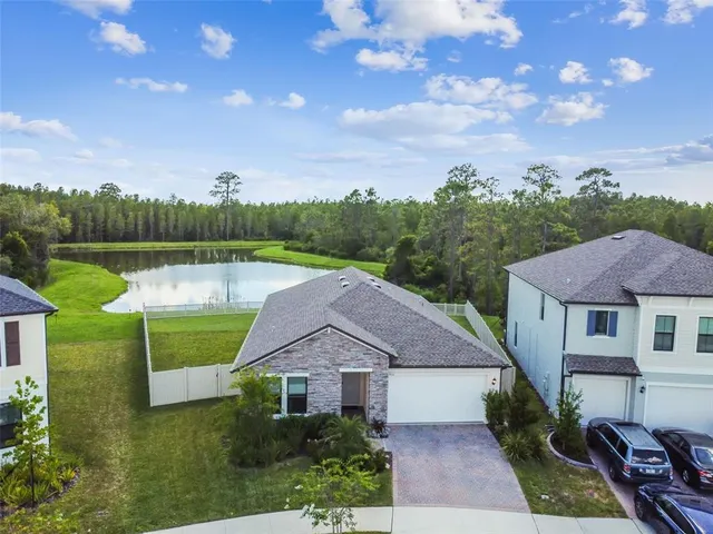 a view of a balcony with yard