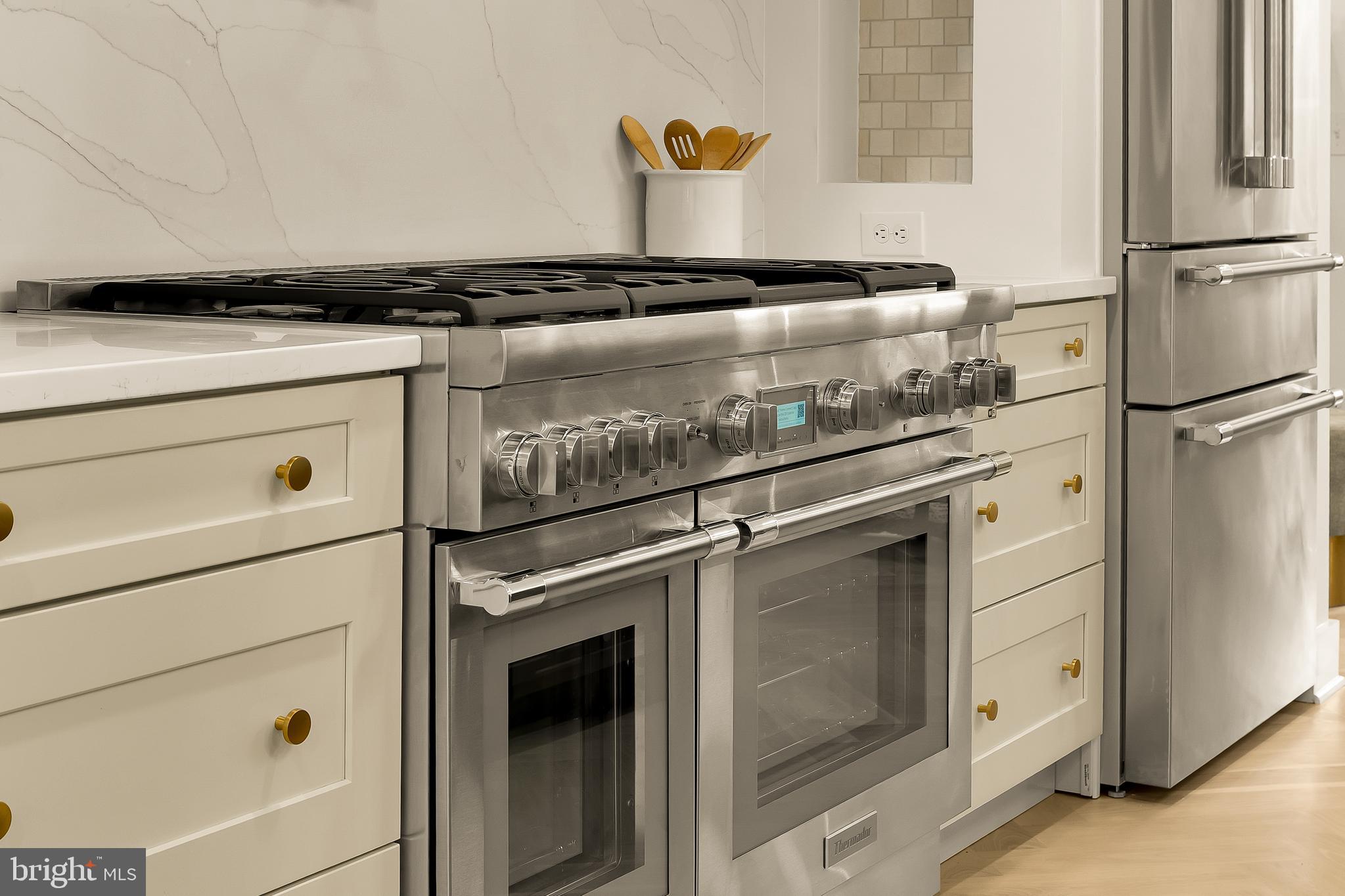 1706 Bay Street Southeast Washington, DC 20003 - Photo 19 of 59 a close view of stove top oven and refrigerator