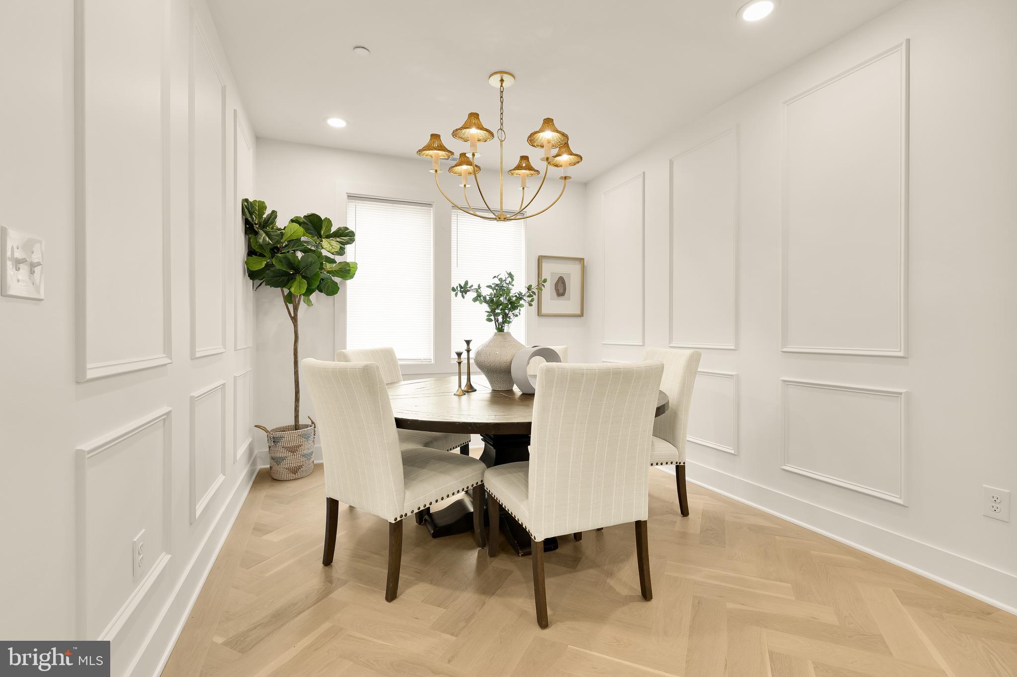 1706 Bay Street Southeast Washington, DC 20003 - Photo 24 of 59 a view of a dining room with furniture and a potted plant
