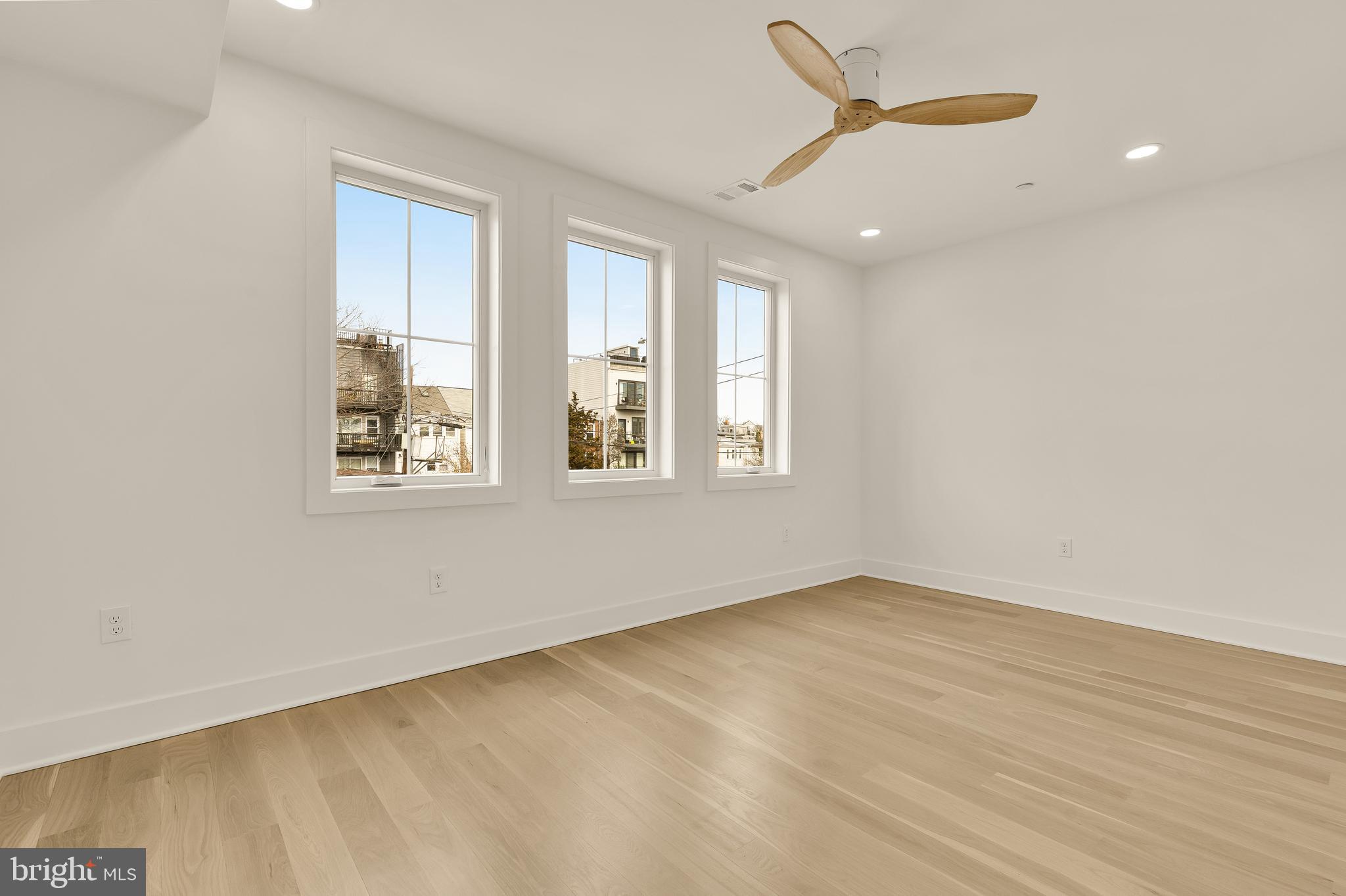 1706 Bay Street Southeast Washington, DC 20003 - Photo 31 of 59 an empty room with wooden floor and windows