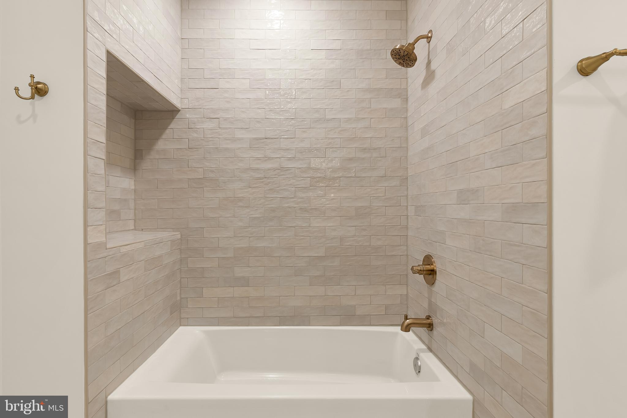 1706 Bay Street Southeast Washington, DC 20003 - Photo 33 of 59 a close up of a bathtub in a bathroom