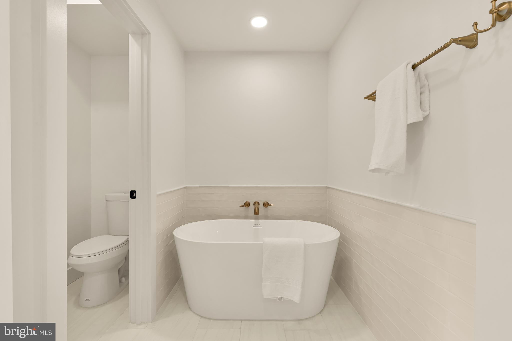 1706 Bay Street Southeast Washington, DC 20003 - Photo 46 of 59 a white bath tub sitting next to a white sink