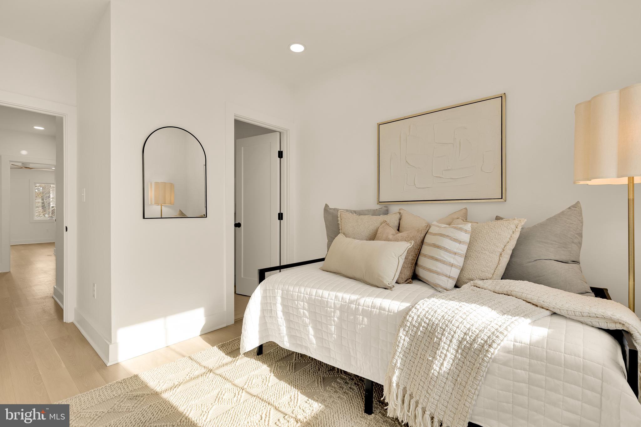 1706 Bay Street Southeast Washington, DC 20003 - Photo 52 of 59 a bedroom with a large bed and a painting