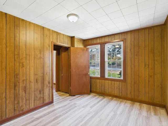 a bathroom with a shower and a glass door