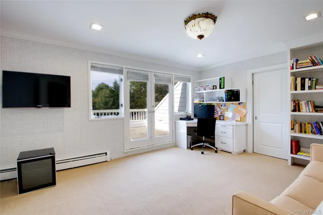 a view of a livingroom with workspace and a couch
