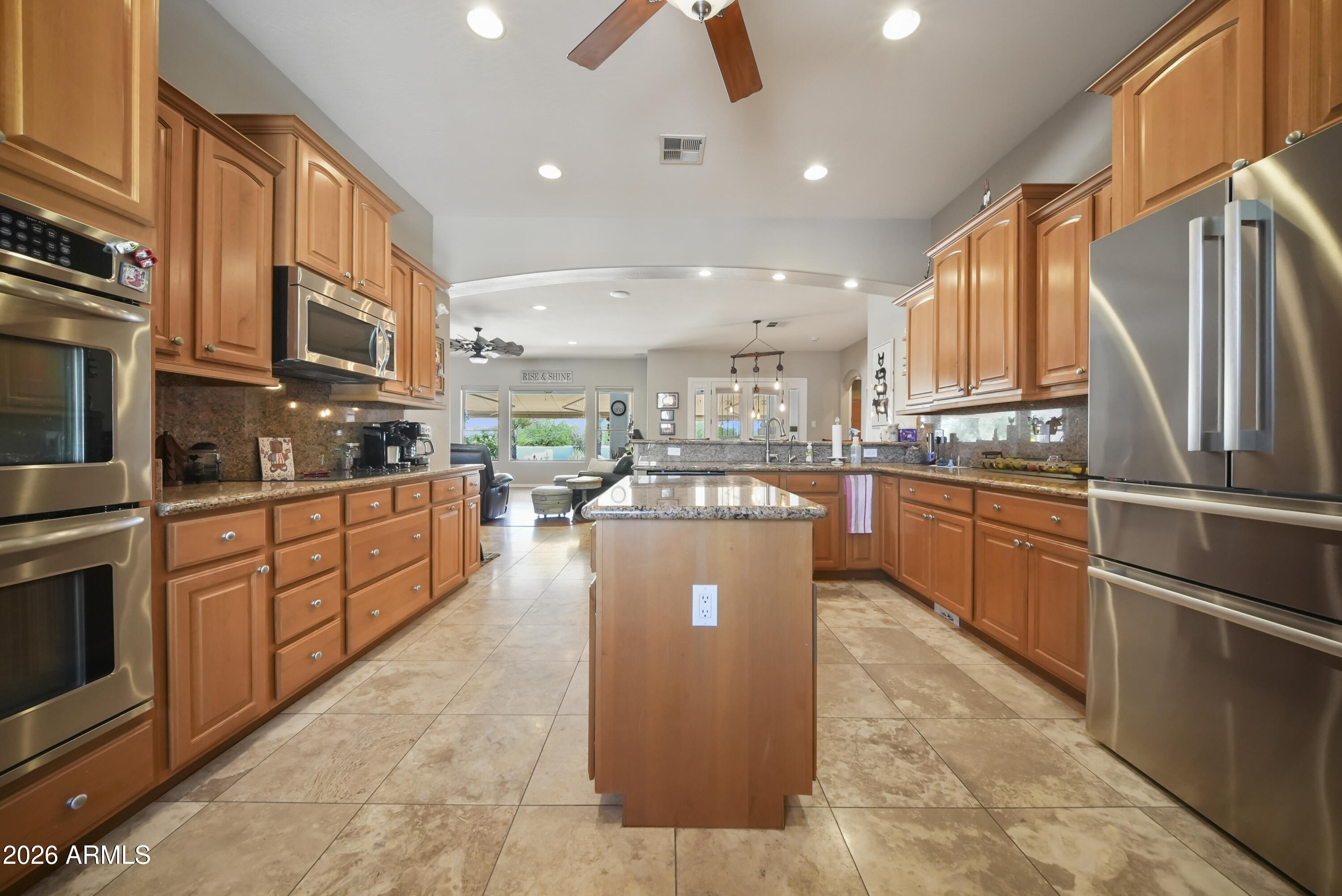 605 West Ridgecrest Road Phoenix, AZ 85086 - Photo 21 of 40 a kitchen with stainless steel appliances granite countertop a refrigerator a stove top oven a sink and dishwasher