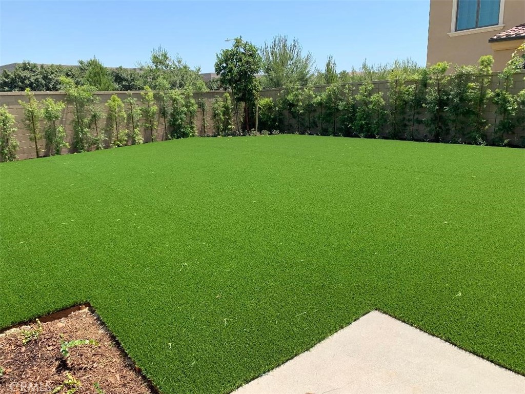 104 San Benito Irvine, CA 92618 - Photo 15 of 19 a view of a field of grass and trees