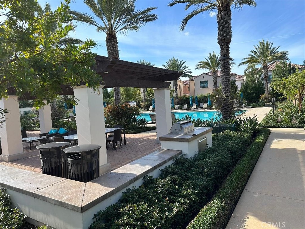 104 San Benito Irvine, CA 92618 - Photo 17 of 19 a view of a patio with couches table and chairs and potted plants