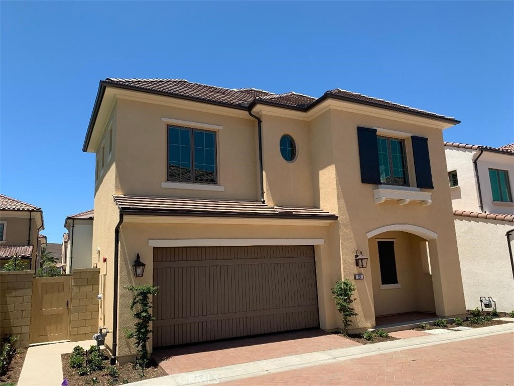 104 San Benito Irvine, CA 92618 - Photo 19 of 19 a front view of a house with a garage