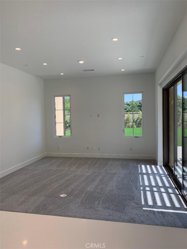 104 San Benito Irvine, CA 92618 - Photo 4 of 19 a view of an empty room and a window
