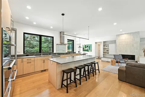 a kitchen with lots of counter top space and living room