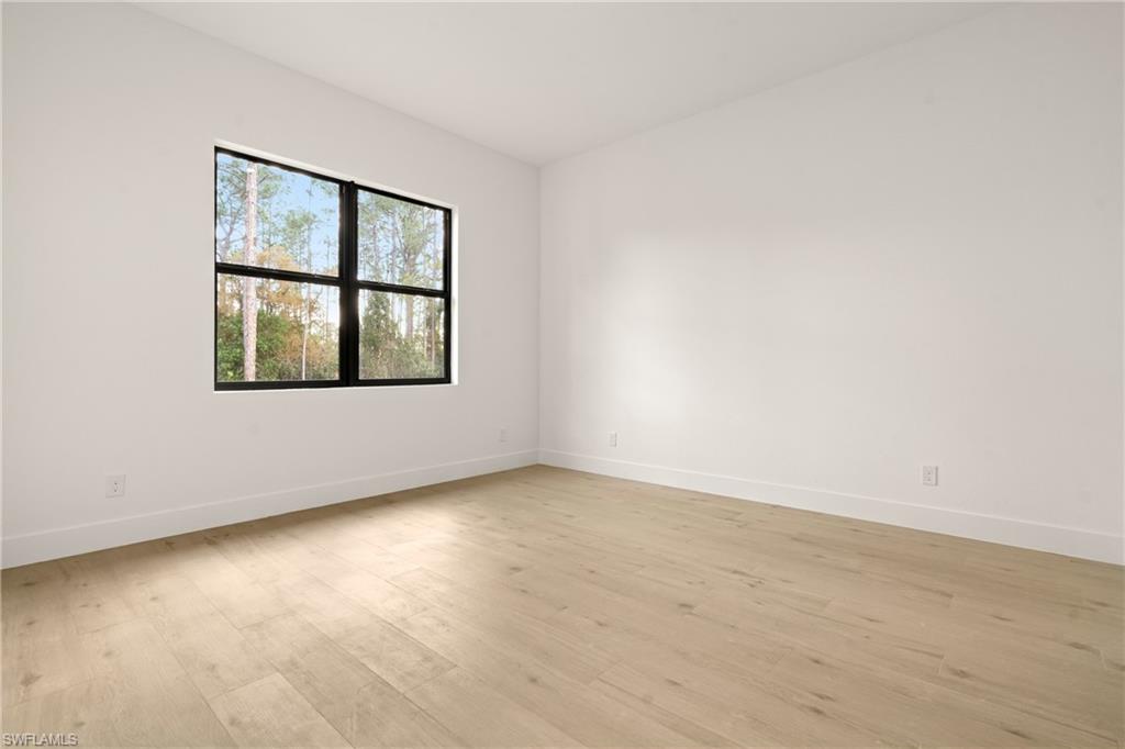 459 Paddock Street Lehigh Acres, FL 33974 - Photo 12 of 16 an empty room with a window