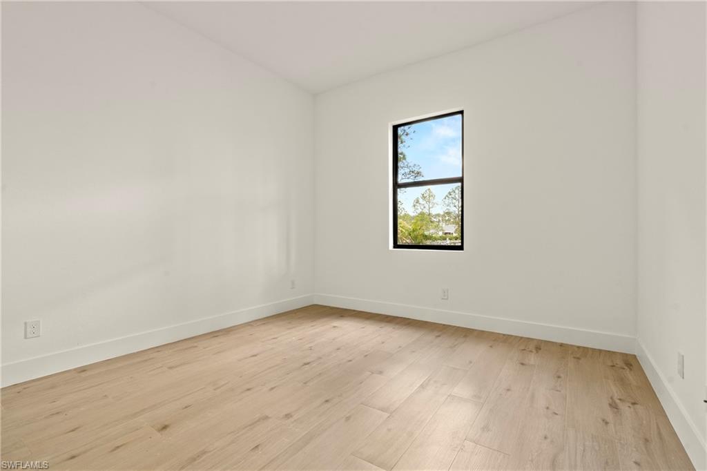 459 Paddock Street Lehigh Acres, FL 33974 - Photo 13 of 16 an empty room with a window
