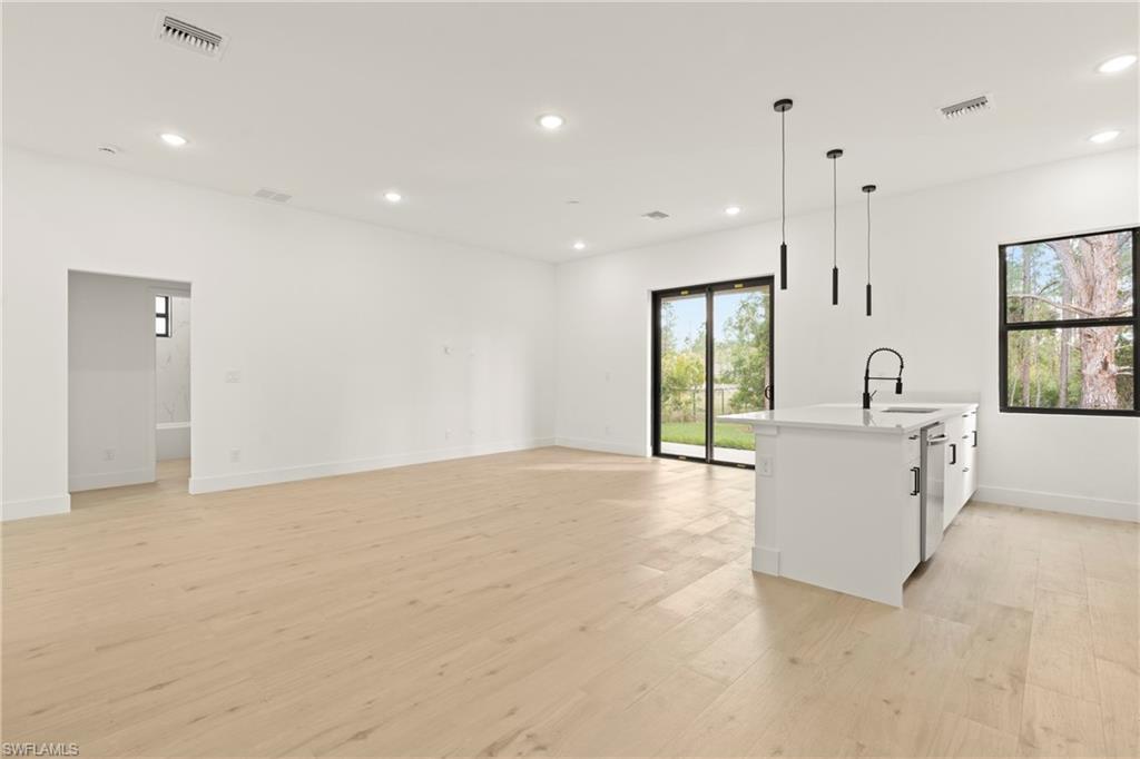 459 Paddock Street Lehigh Acres, FL 33974 - Photo 8 of 16 a view of an empty room with glass door and balcony