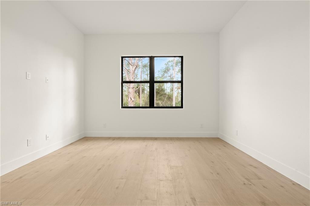 459 Paddock Street Lehigh Acres, FL 33974 - Photo 9 of 16 an empty room with a window