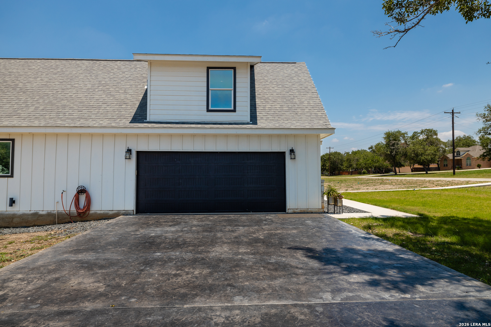 240 Eagle Rock Poteet, TX 78065 - Photo 20 of 25 a front view of a house with a yard