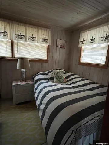 a bedroom with a bed and couch