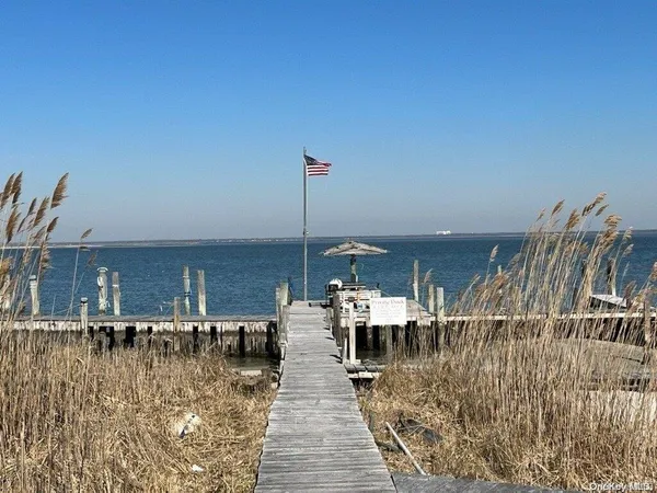 a view of a swimming pool with outdoor seating