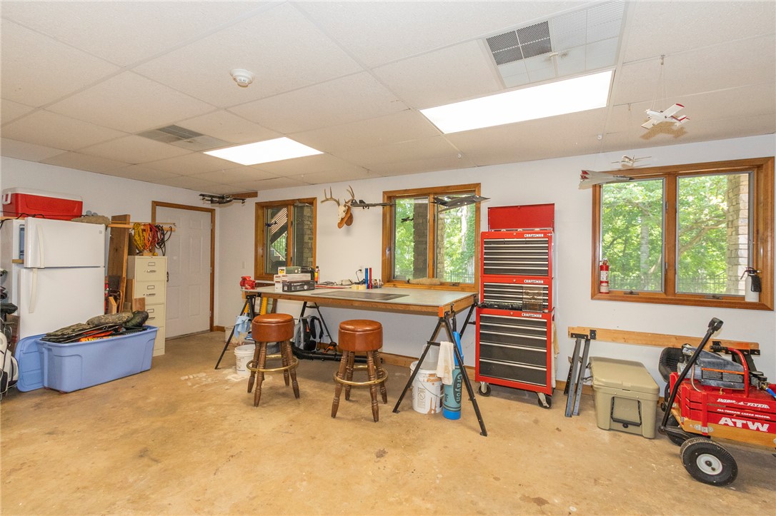 202 Plantation Point Anderson, SC 29625 - Photo 40 of 48 A well-lit garage offers a functional workbench, ideal for projects.