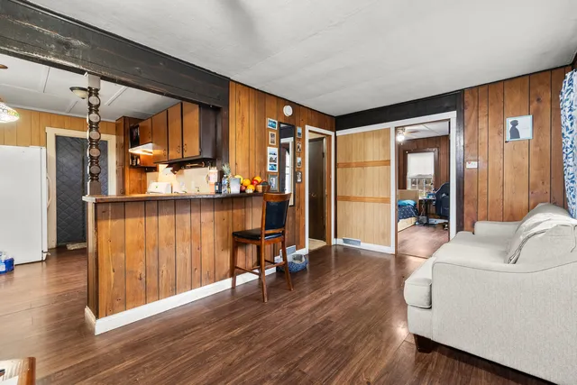 a living room with furniture and large windows