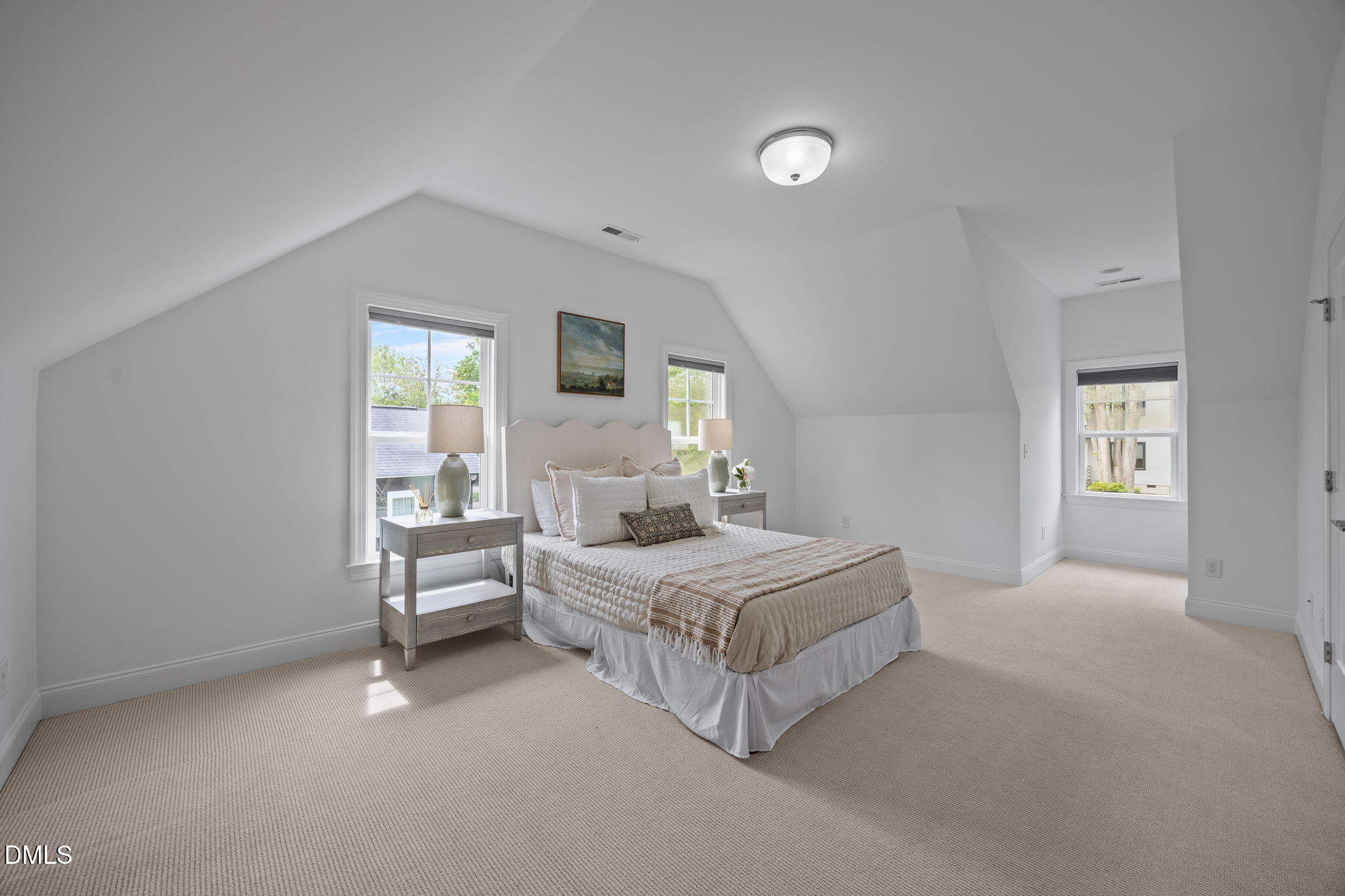 804 Hartford Road Raleigh, NC 27610 - Photo 19 of 26 a bedroom with a bed and a window